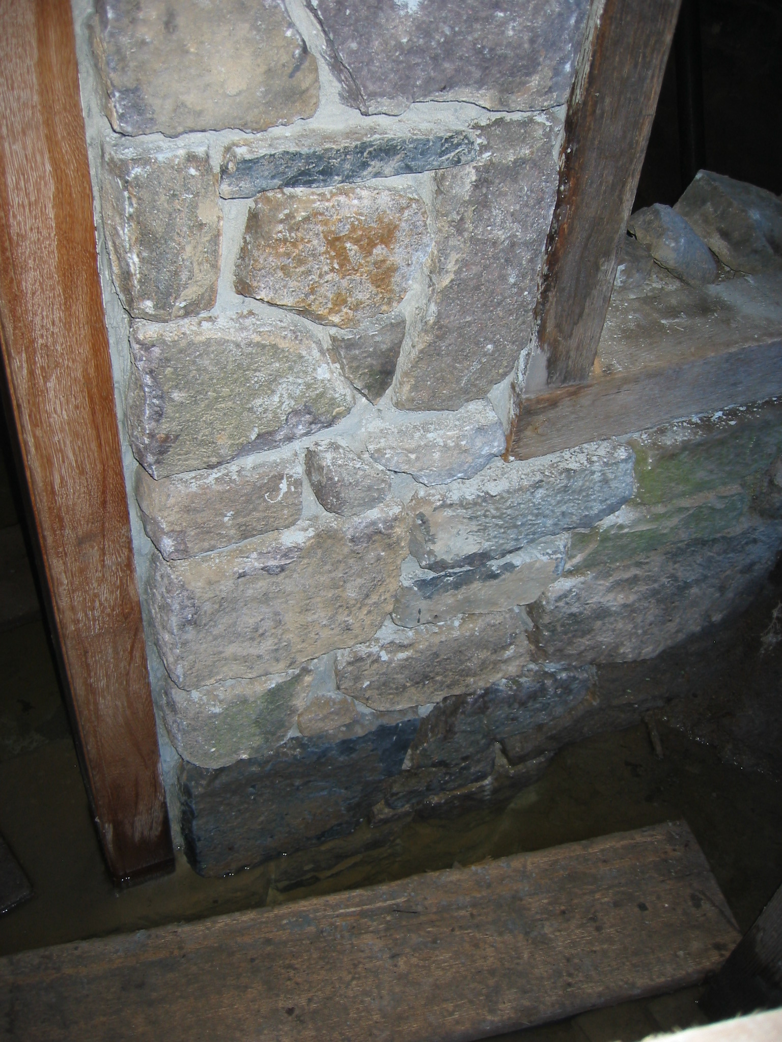 Restored N masonry pier, kitchen cellar doorway, before repointing (2009)