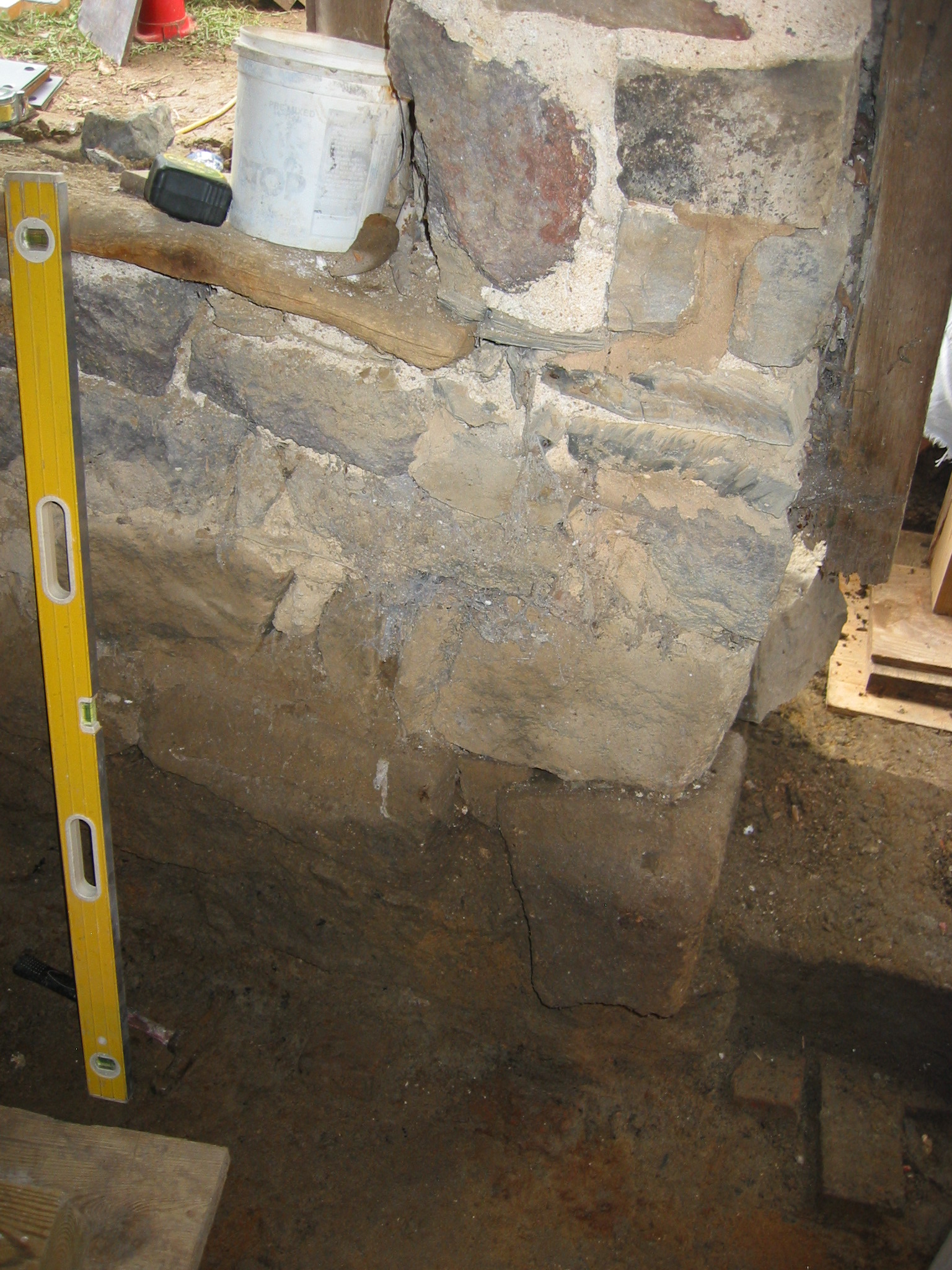 DeTurk masonry pier between cellar doorway and window