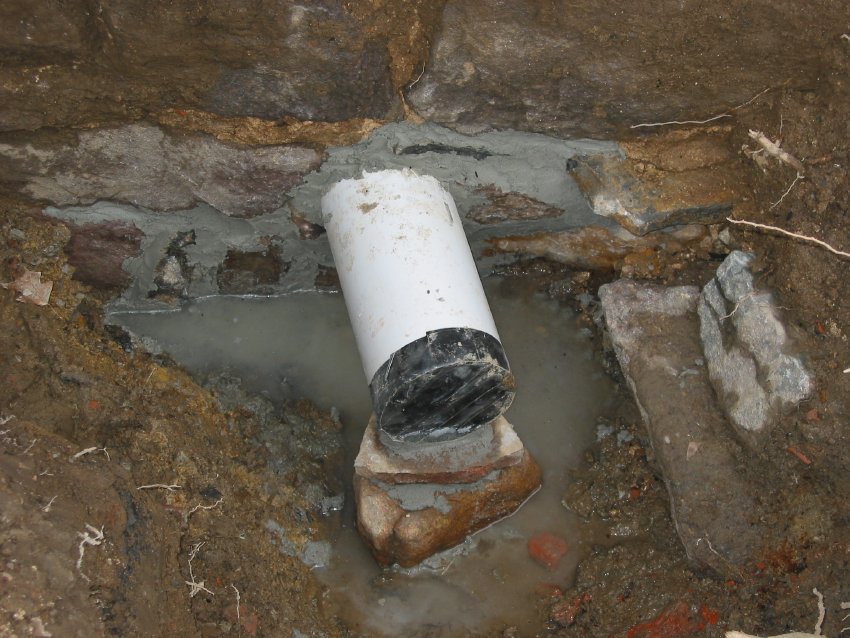 Exterior view of new DeTurk kitchen drain outlet pipe
