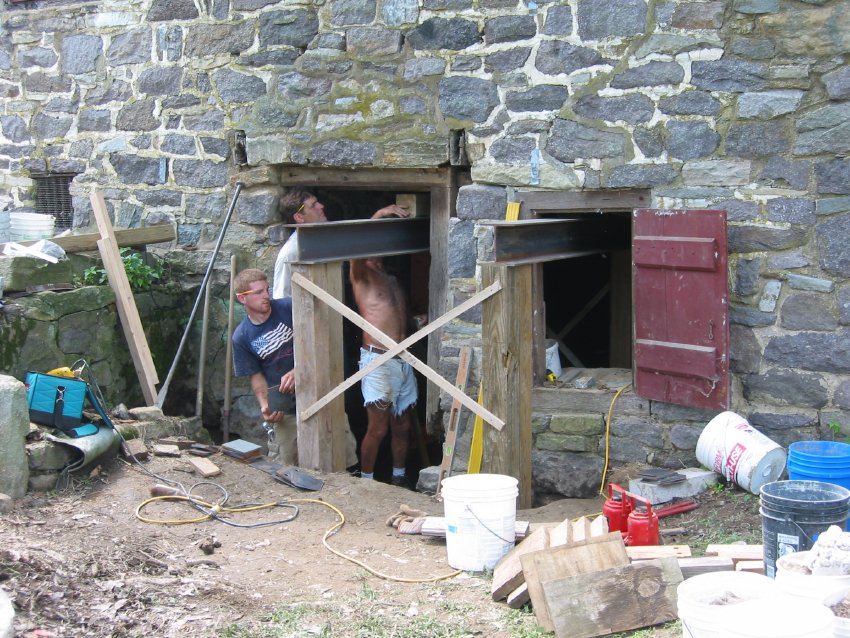Setting I-beam shoring during restoration of DeTurk east eaves wall (2009)