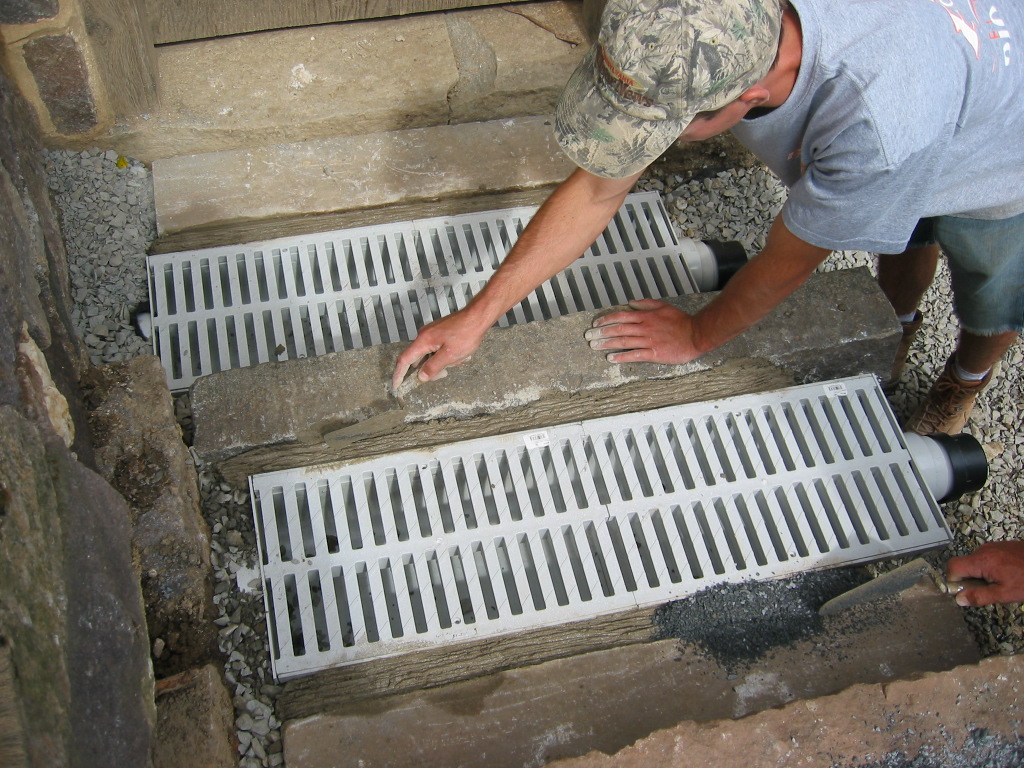 0063--: Troweling mortar into joints flanking CD2