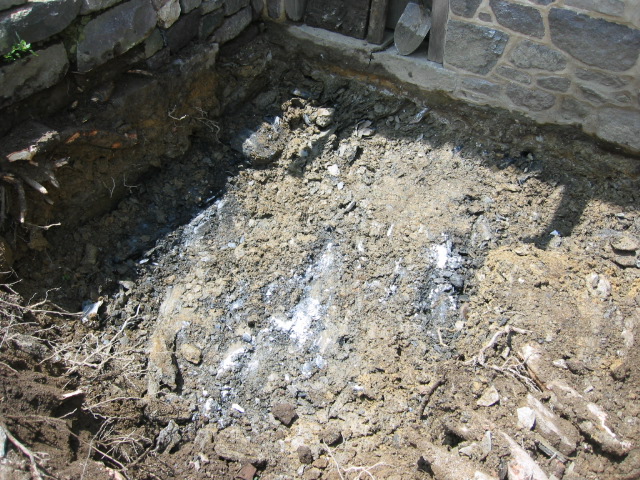 2634--Brittle top layer of lmestone bedrock found 18" below top of door sil