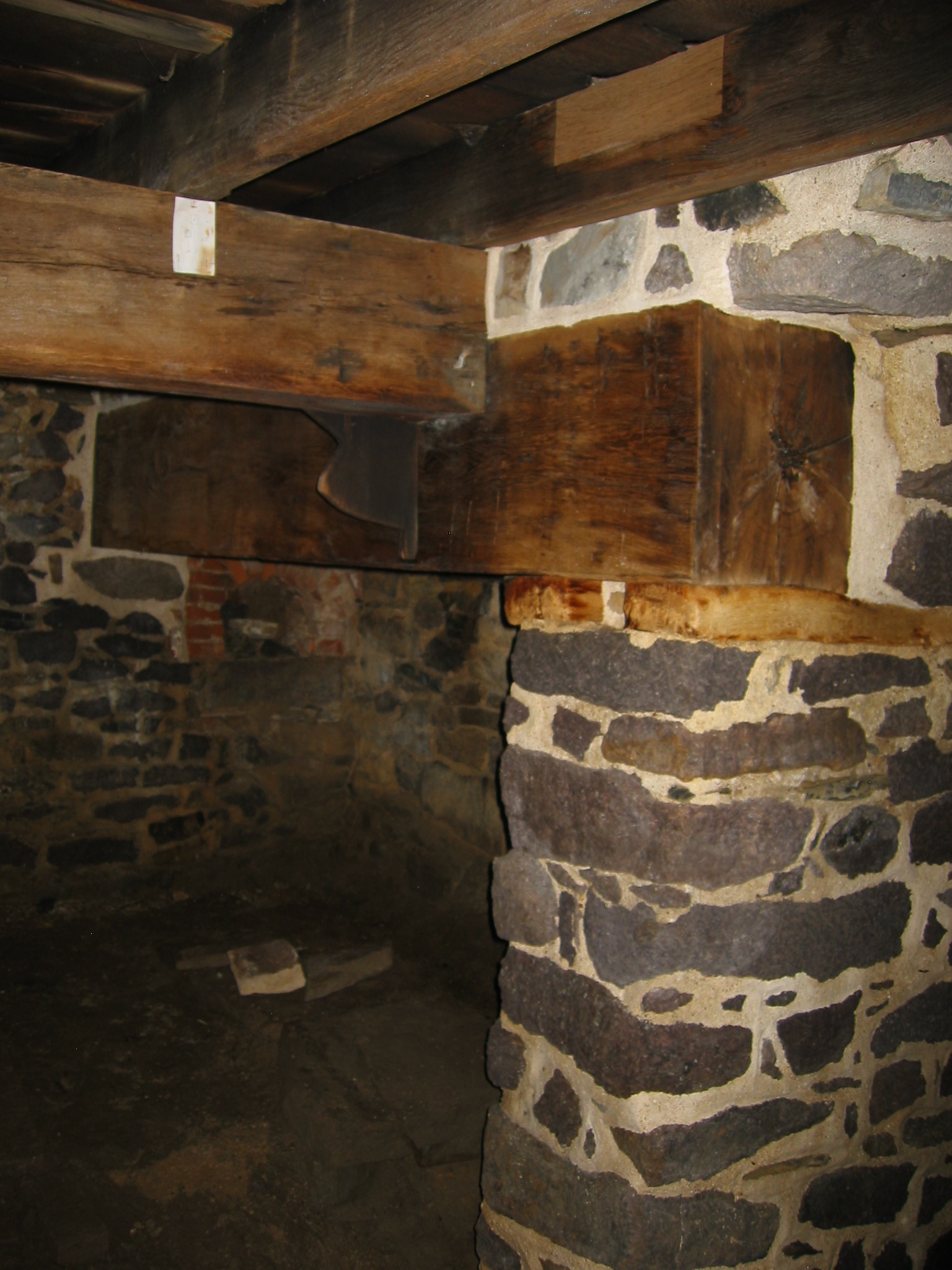 0092, 7/25/10: summer beam, reset on fireplace lintel; restored pier