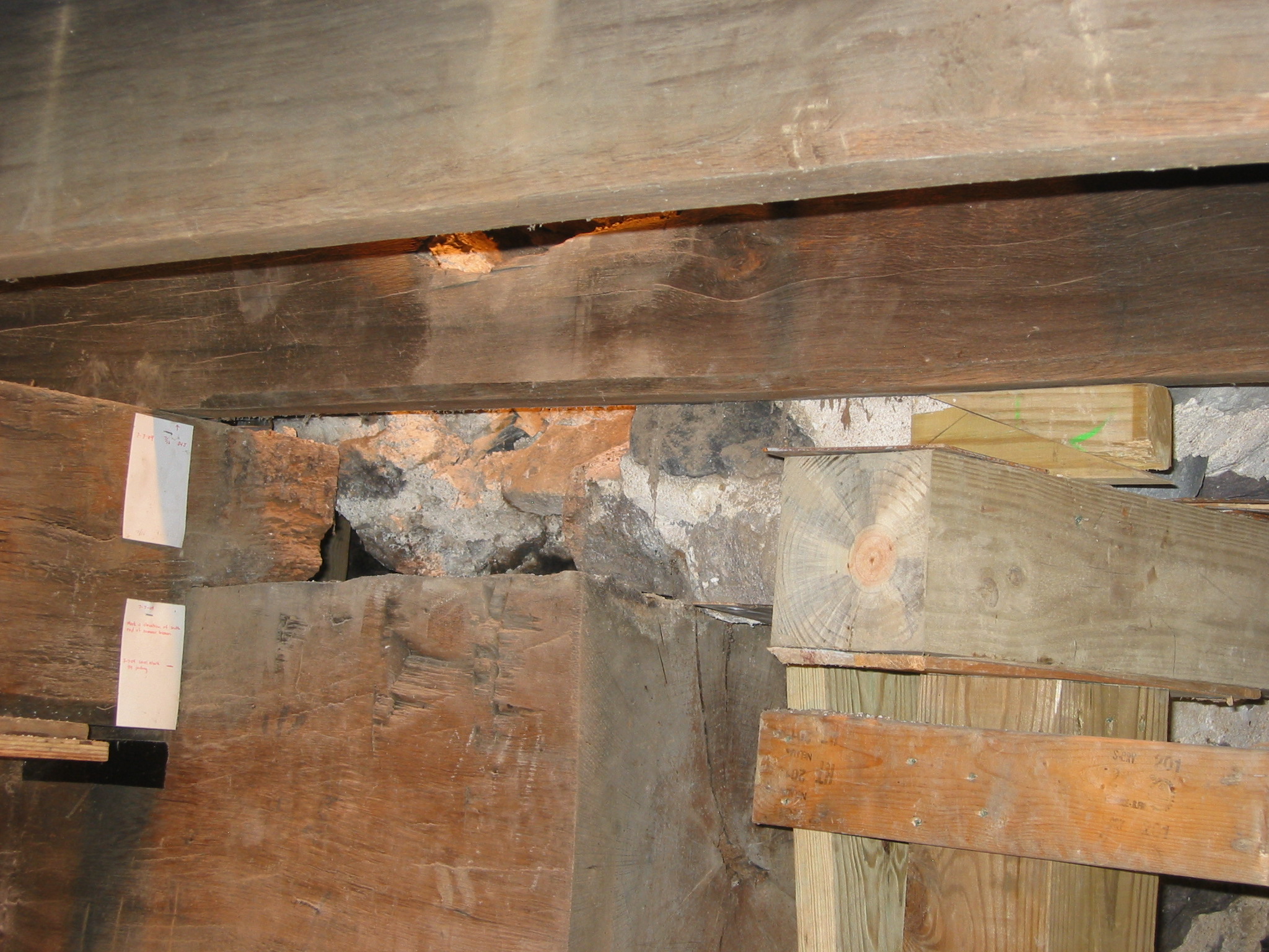 942, 8/18/09: Summer beam bearing on fireplace lintel and temporary shoring