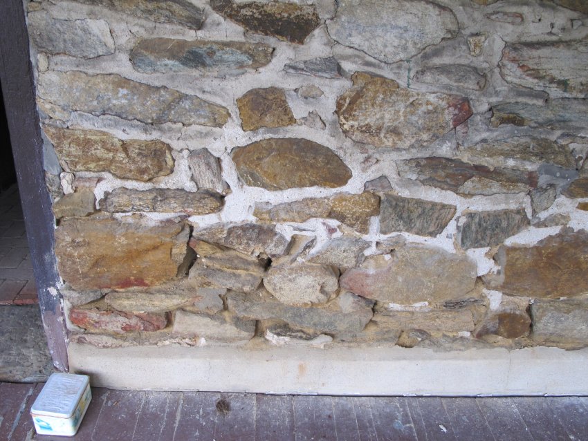 #23, 4162: stone wall above porch floor, concrete base-block