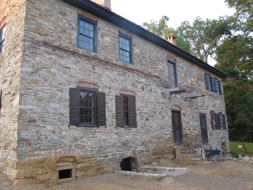 #3, 5522: Keim south wall with flashing course over pent roof joint