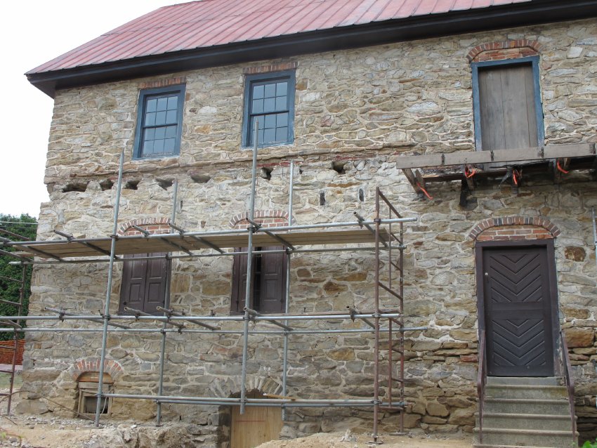 #40, 4802: south wall showing massive gouges for 1930s porch rafter beds