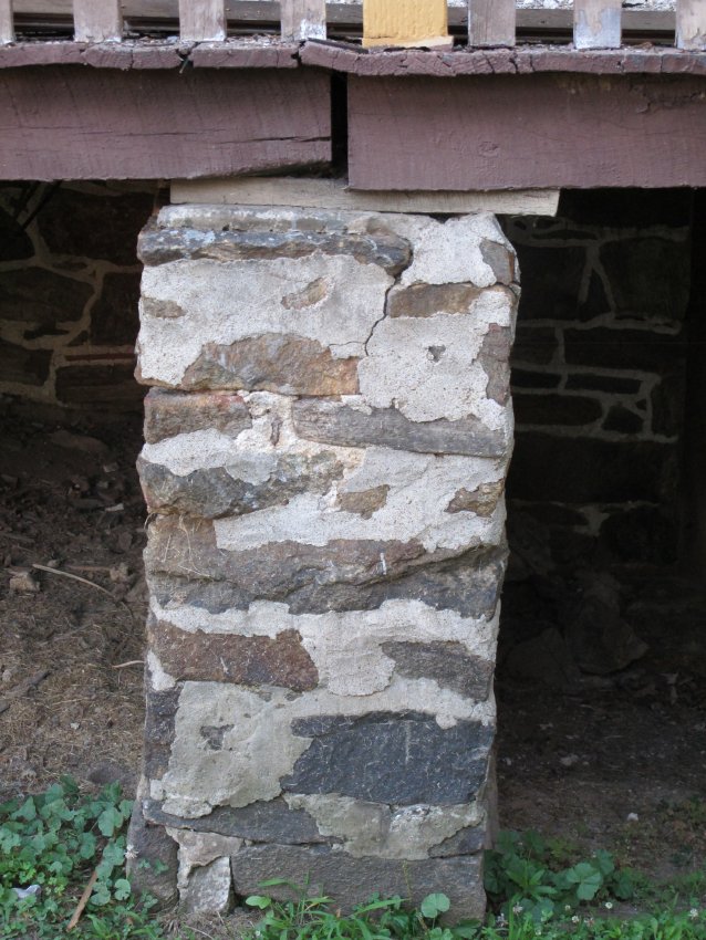 #7, 4284: stone pier supporting deteriorating porch-deck joint