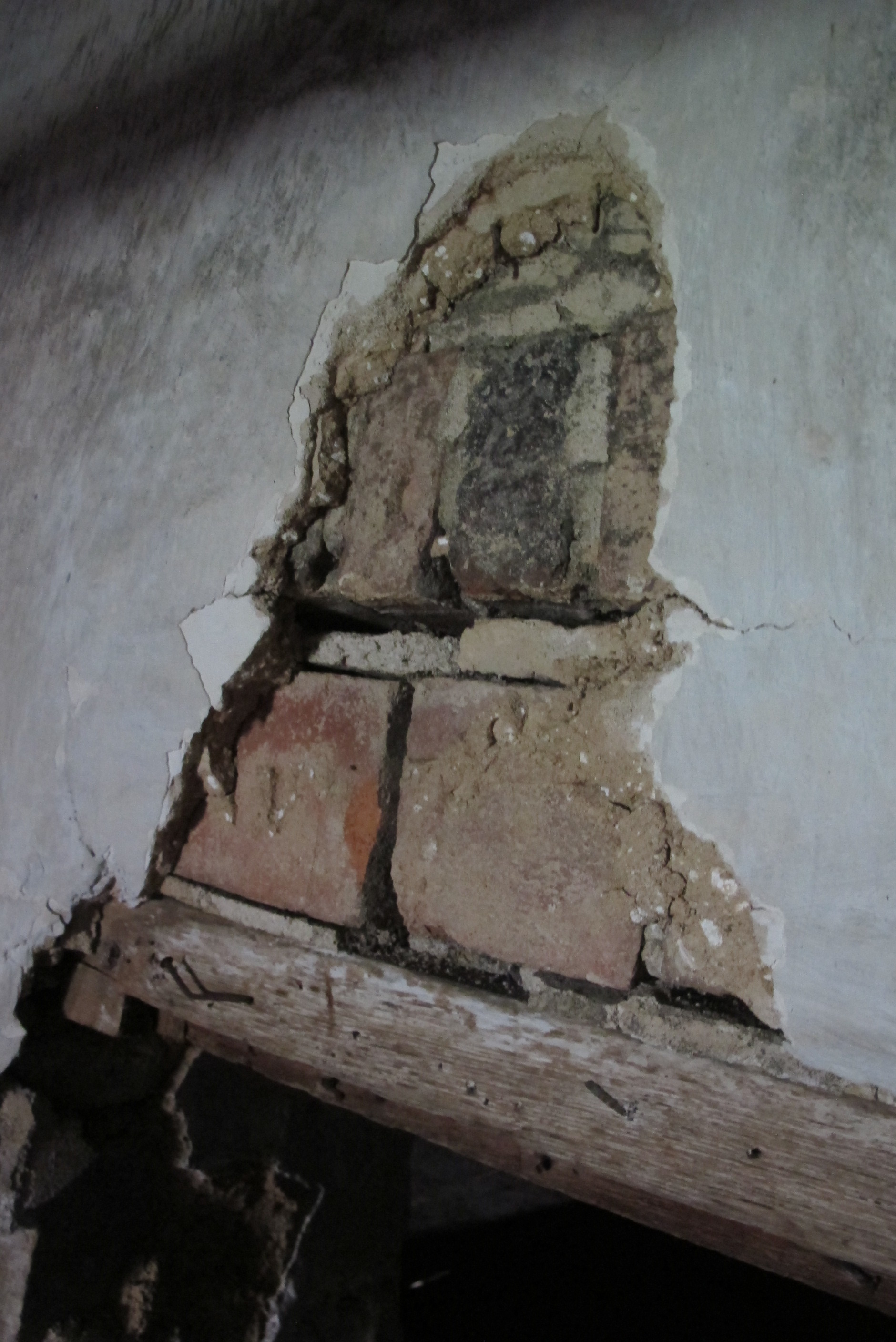 #5: Segment of brick relieving arch over window opening, east gable