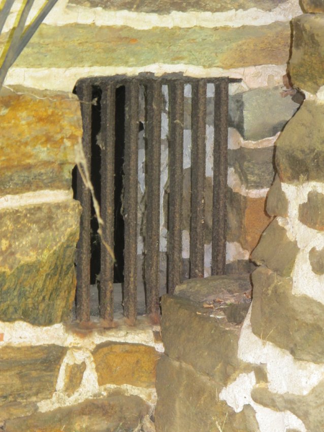 Image #5: Keim house iron-grilled cellar vent