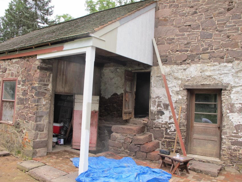 #9: 6133: Roof extension hood over doorways in Douglass Store-yard
