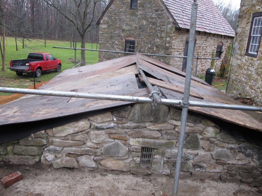 #8, 6944- Restored end-wall of Keim root cellar, grilled vent, and temp. ro