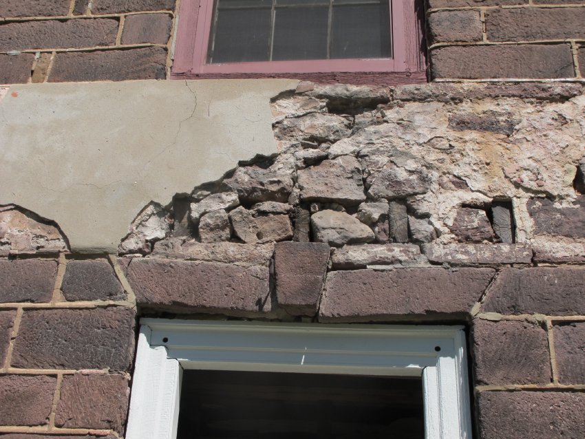 Image #2, 8031: Failing rubble stone range above façade doorway