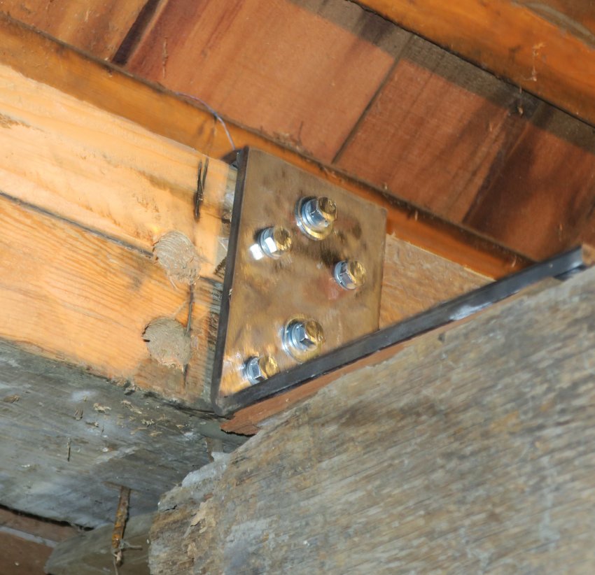 #16: Bracket bolted to rafter plate and joist, forming tie-beam