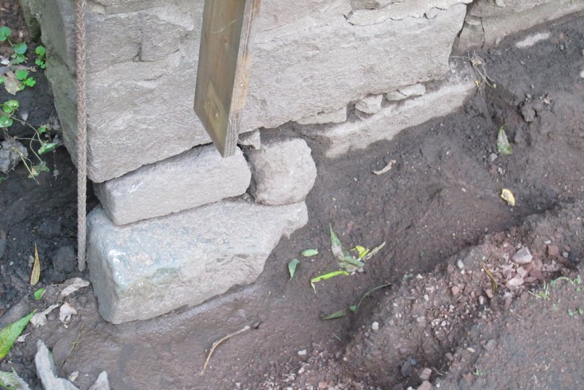 Image #1: failed foundation plinth at NW corner, below grade