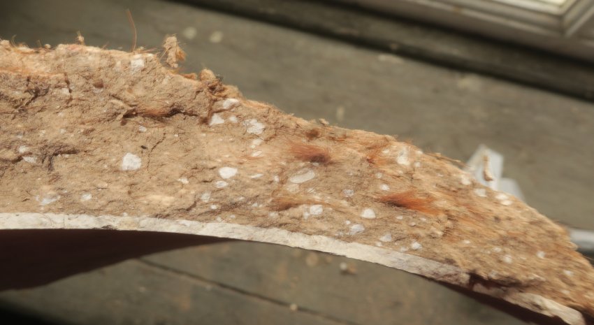 #6: Cornice plaster fragment with lime bits and hair binder