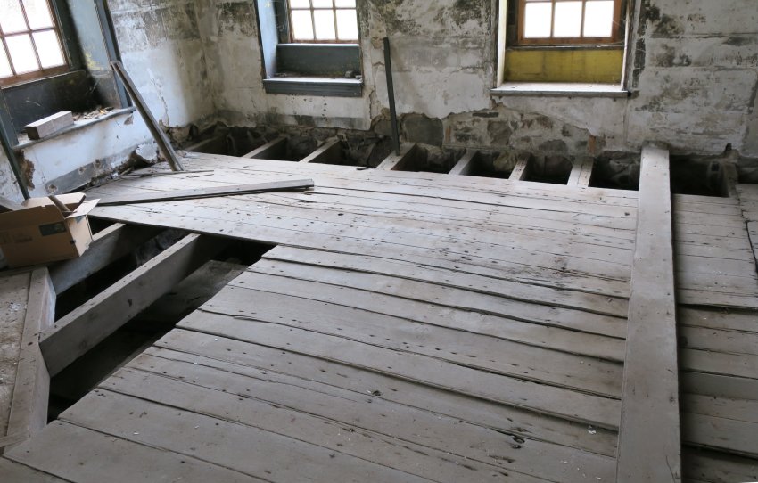 #12: Worn and deformed flooring, back parlor
