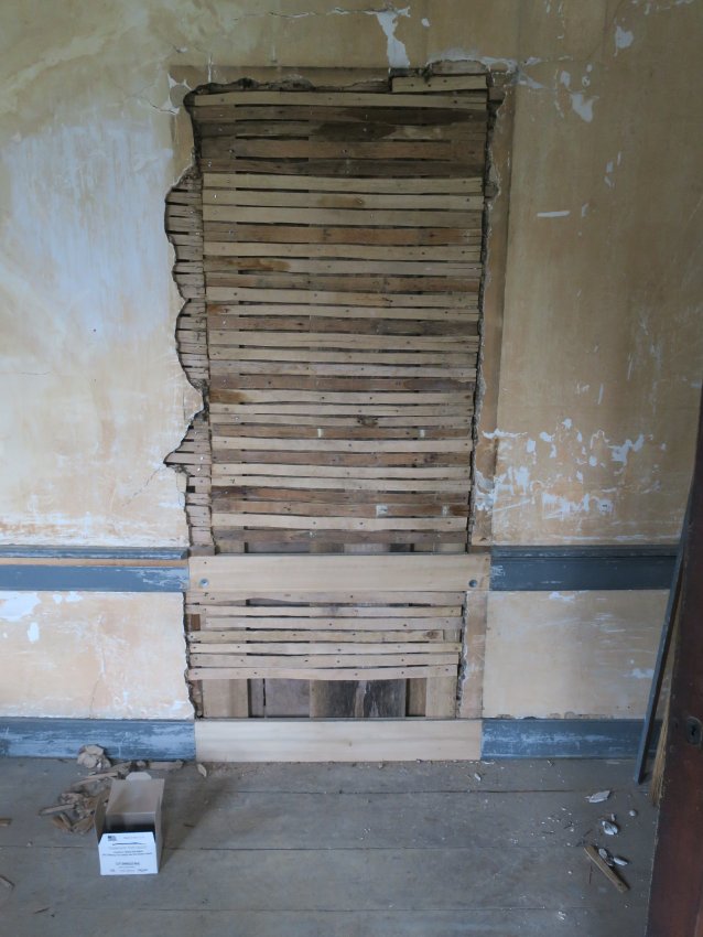 #2: Non-period interior doorway closed and lathed